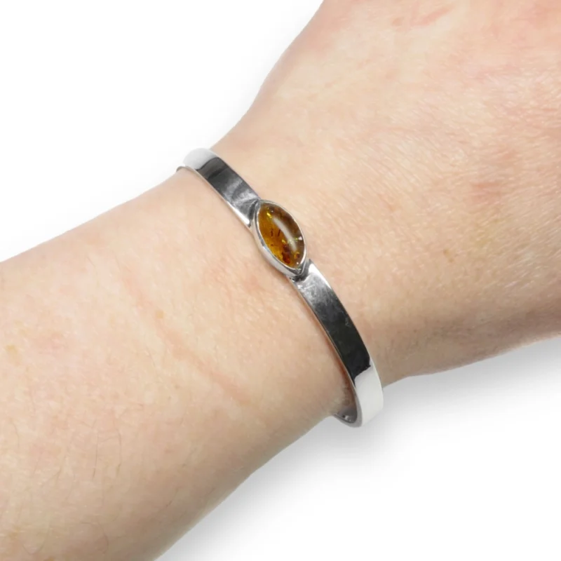 Sterling silver and 14 x 7mm Amber Bangle with plain band